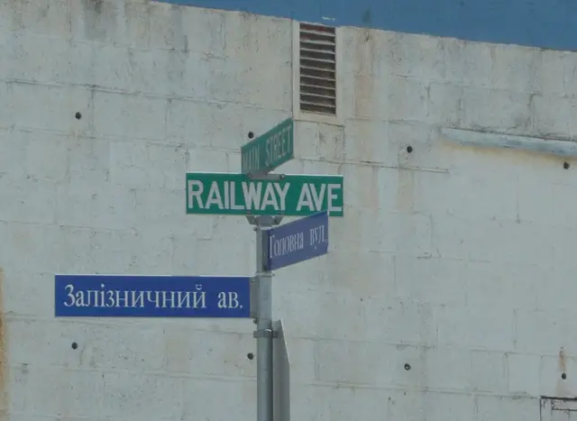 Bilingual street sign at Main Street and Railway Ave
