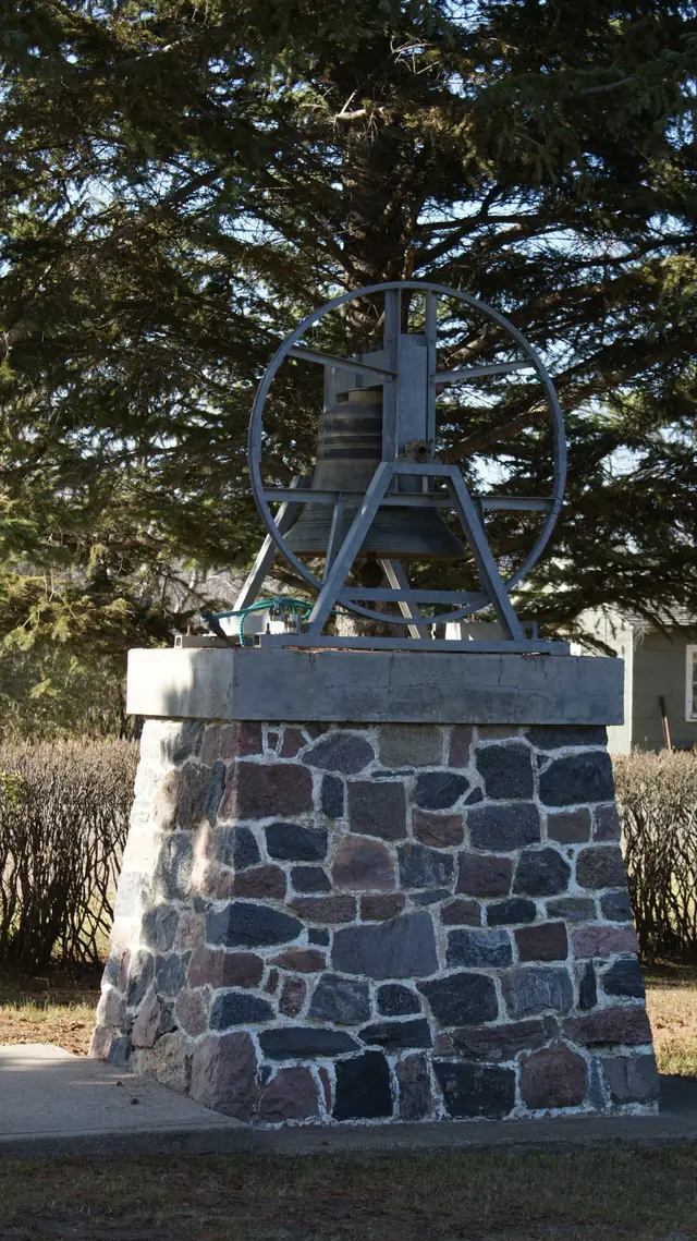 Church bell on a fieldstone monument